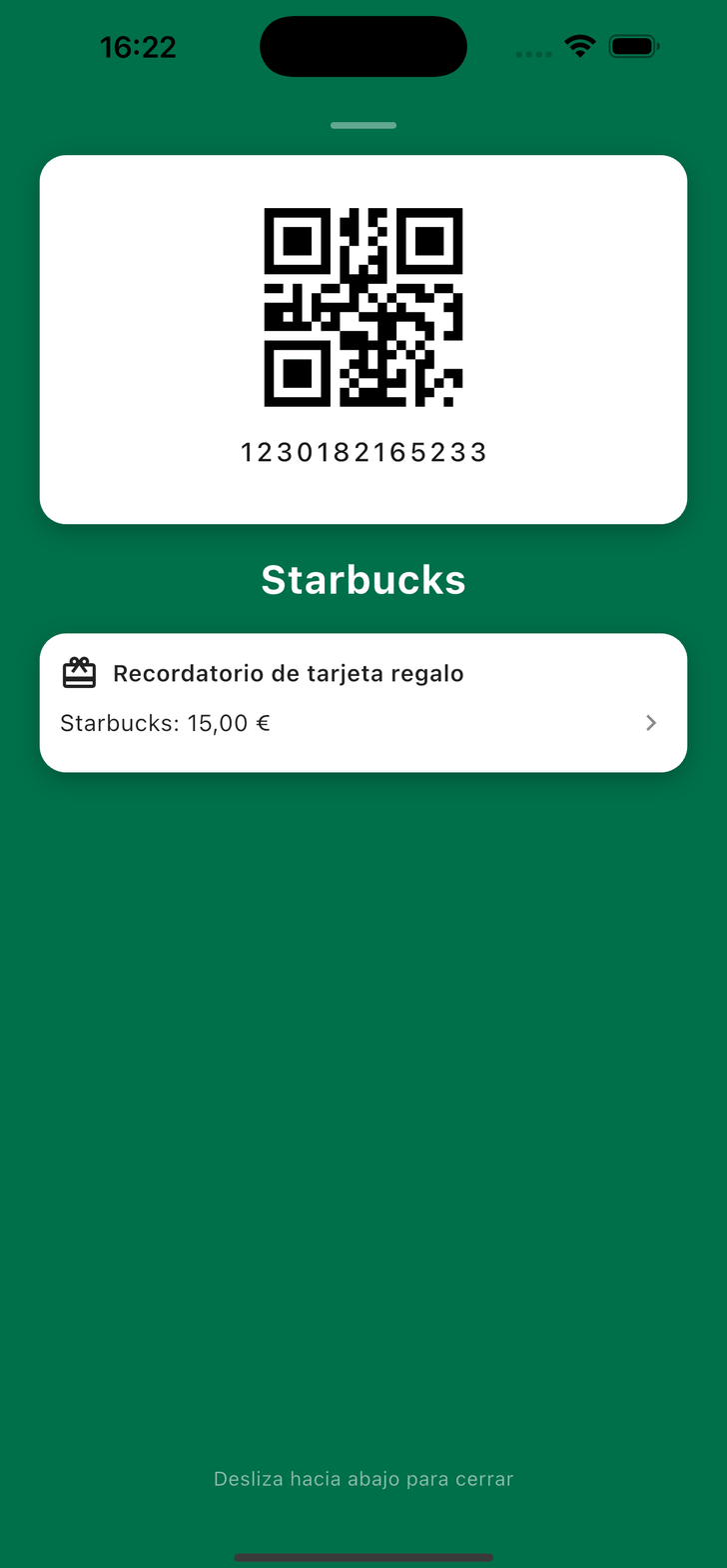 Tarjeta de fidelidad Starbucks abierta en la caja, con un aviso de tarjeta regalo que muestra 15 € de saldo