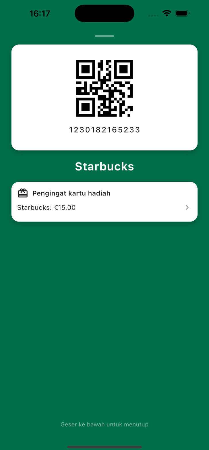 Kartu loyalitas Starbucks terbuka di kasir, dengan pengingat kartu hadiah bersaldo €15