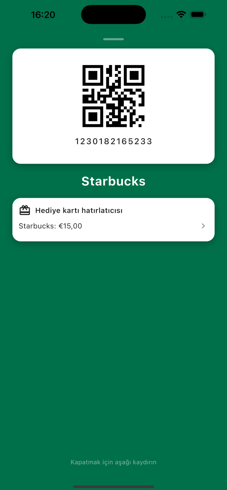 Kasada açık Starbucks sadakat kartı, 15 € bakiye gösteren hediye kartı hatırlatmasıyla